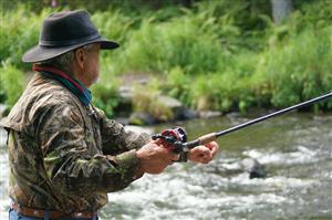 Senior Gentleman Fishing On The River